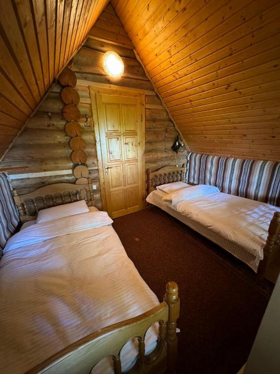 Postel nebo postele na pokoji v ubytování Ялинка