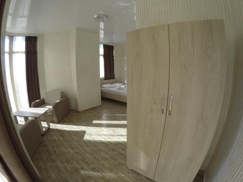 Postel nebo postele na pokoji v ubytování New Batumi Inn Hotel
