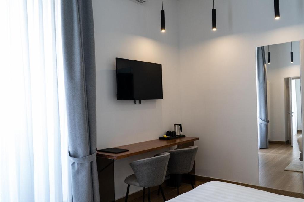 Telewizja i/lub zestaw kina domowego w obiekcie 4heavens_naples