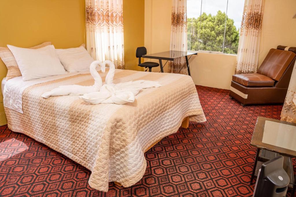 Postel nebo postele na pokoji v ubytování Hotel Summita