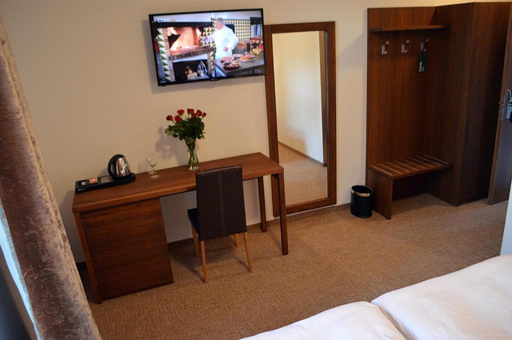 TV a/nebo společenská místnost v ubytování Hotel U Kvapilů