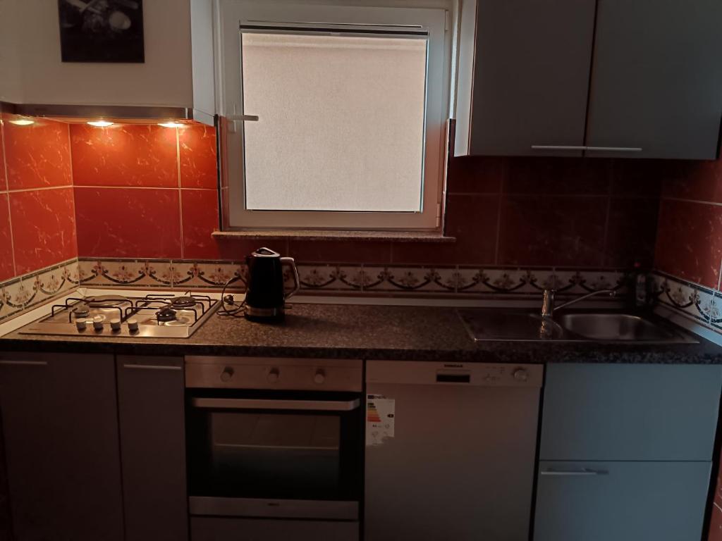 Kuchyň nebo kuchyňský kout v ubytování Apartments Moreta