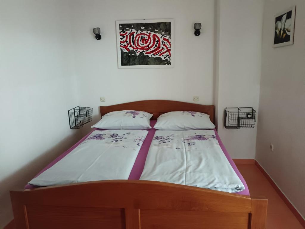 Postel nebo postele na pokoji v ubytování Apartments Moreta