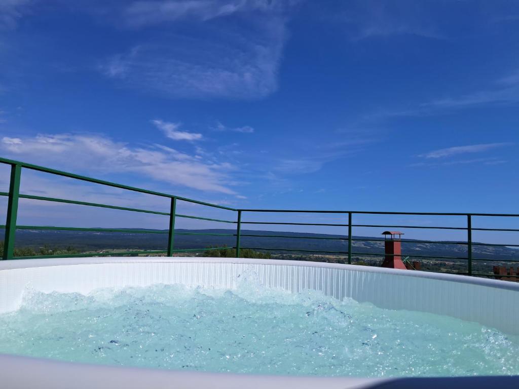 a bath tub filled with water with a view at Apartamenty przy szlaku in Krajno Pierwsze
