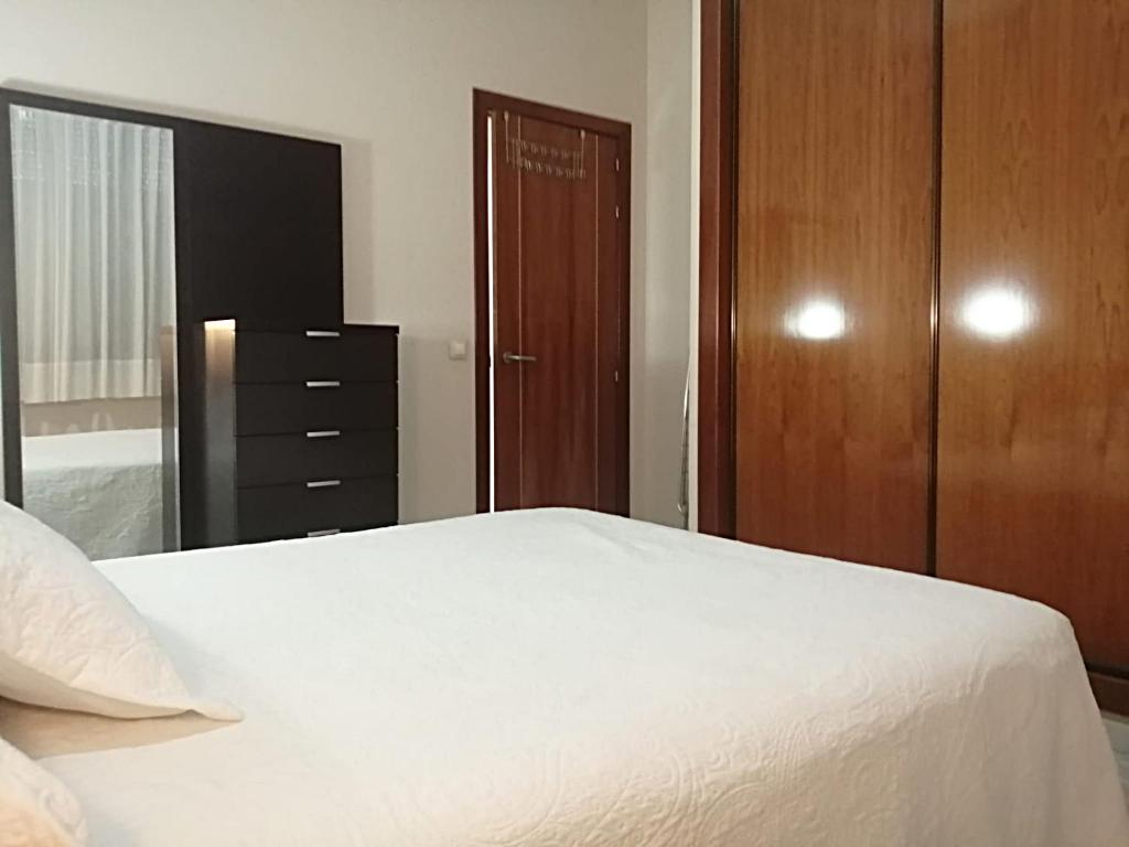 Postel nebo postele na pokoji v ubytování Edificio Luxsevilla