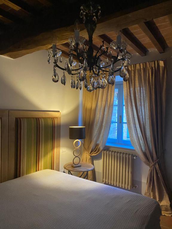 Postel nebo postele na pokoji v ubytování Il Borghetto Andrea Tafi