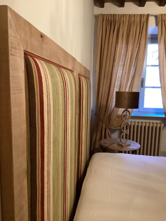 Postel nebo postele na pokoji v ubytování Il Borghetto Andrea Tafi