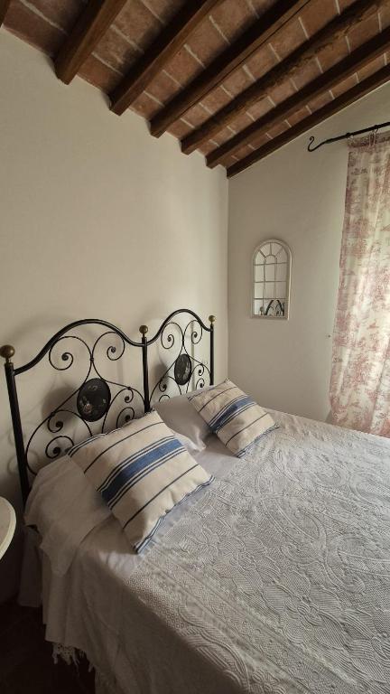 Postel nebo postele na pokoji v ubytování Il Borghetto Andrea Tafi
