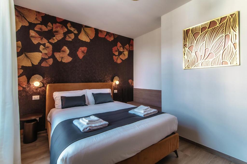 Voodi või voodid majutusasutuse Hotel Ristorante La Vignetta Cernobbio toas