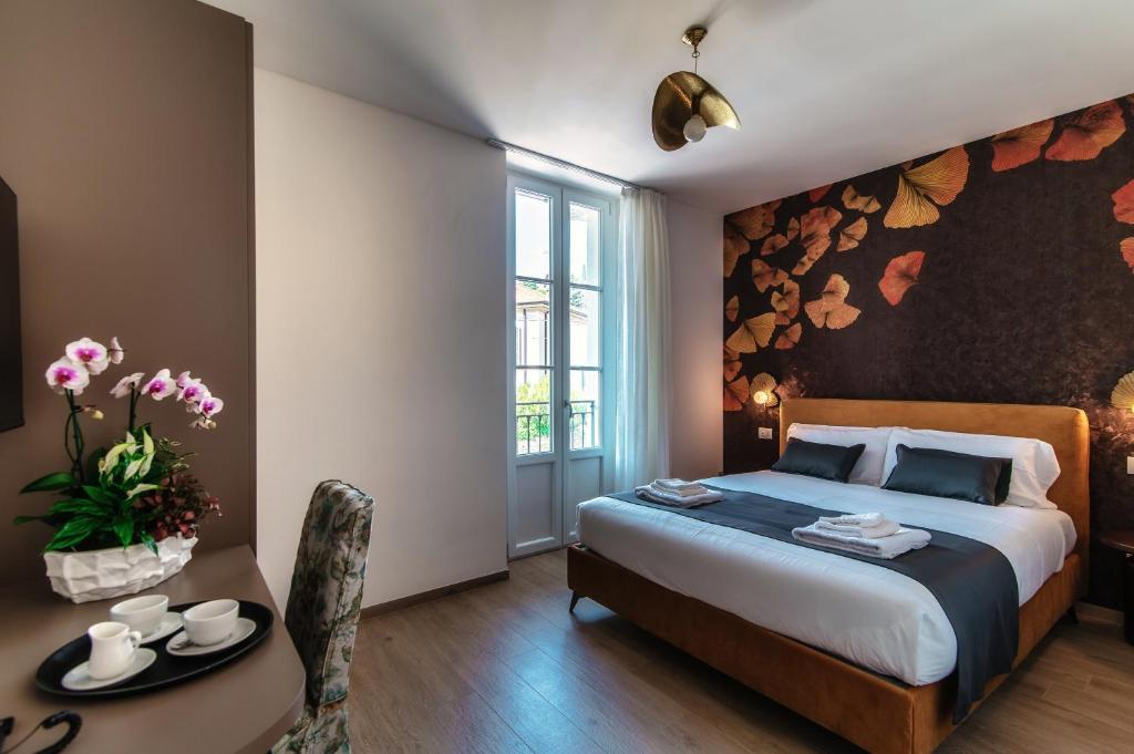 Voodi või voodid majutusasutuse Hotel Ristorante La Vignetta Cernobbio toas