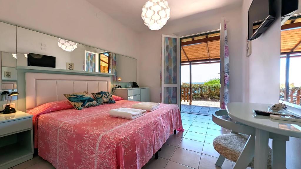 Кровать или кровати в номере Hotel Capo Sud
