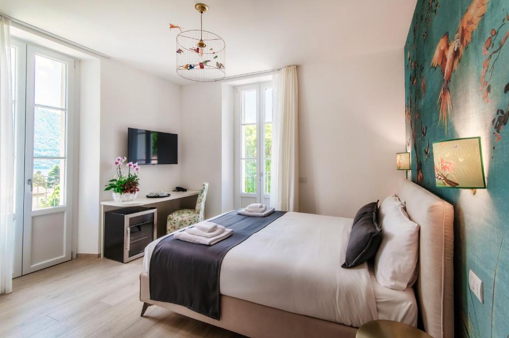 Voodi või voodid majutusasutuse Hotel Ristorante La Vignetta Cernobbio toas