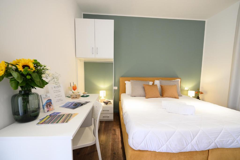 Postel nebo postele na pokoji v ubytování Baitan Hotel