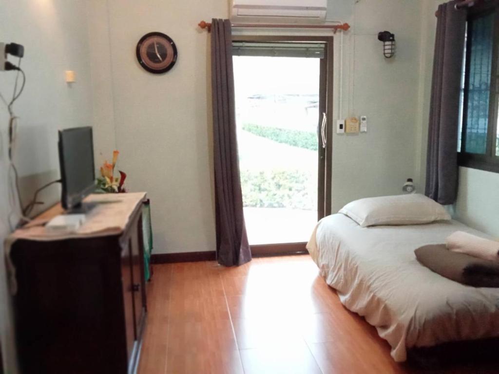 Postel nebo postele na pokoji v ubytování Casa Bonita Kanchanaburi