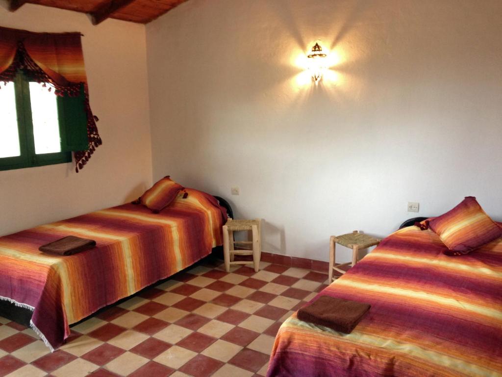 Een bed of bedden in een kamer bij Ferma Jebala Ecolodge