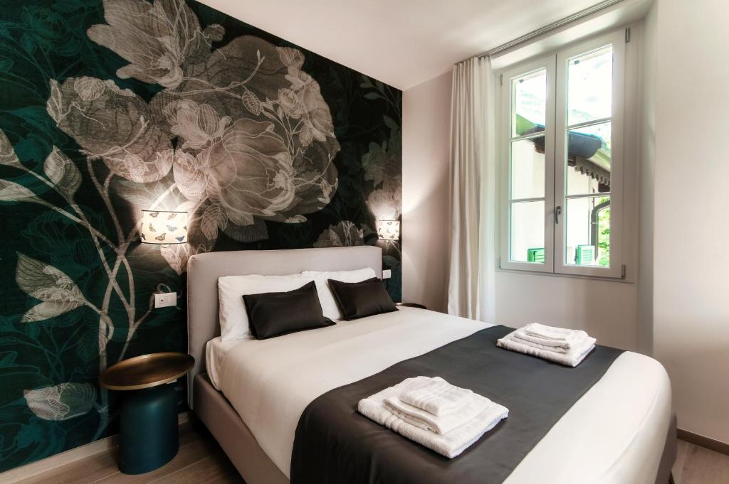 Voodi või voodid majutusasutuse Hotel Ristorante La Vignetta Cernobbio toas