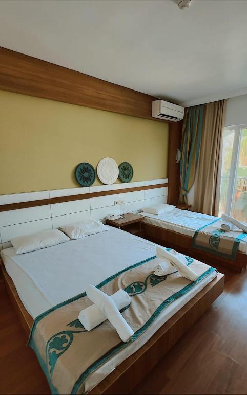 Postel nebo postele na pokoji v ubytování Luca Antalya