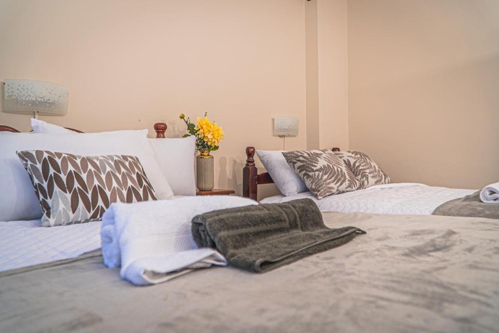 Postel nebo postele na pokoji v ubytování UKUKU Hostel
