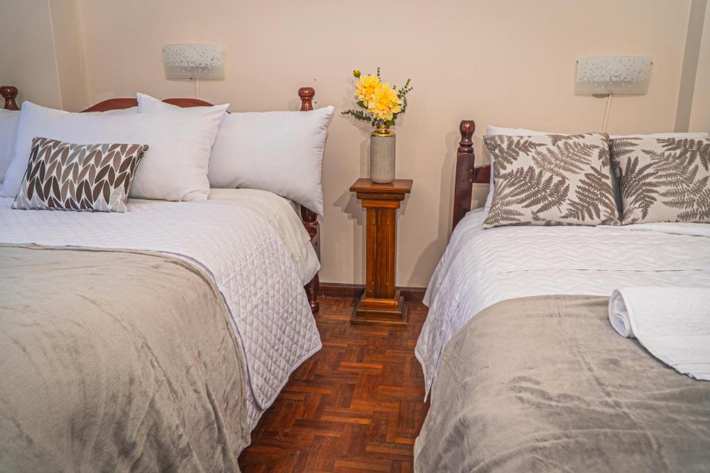 Postel nebo postele na pokoji v ubytování UKUKU Hostel