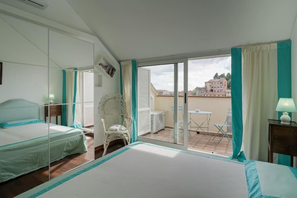 Cama o camas de una habitación en Casa Magia - Sea View - Air Conditioning