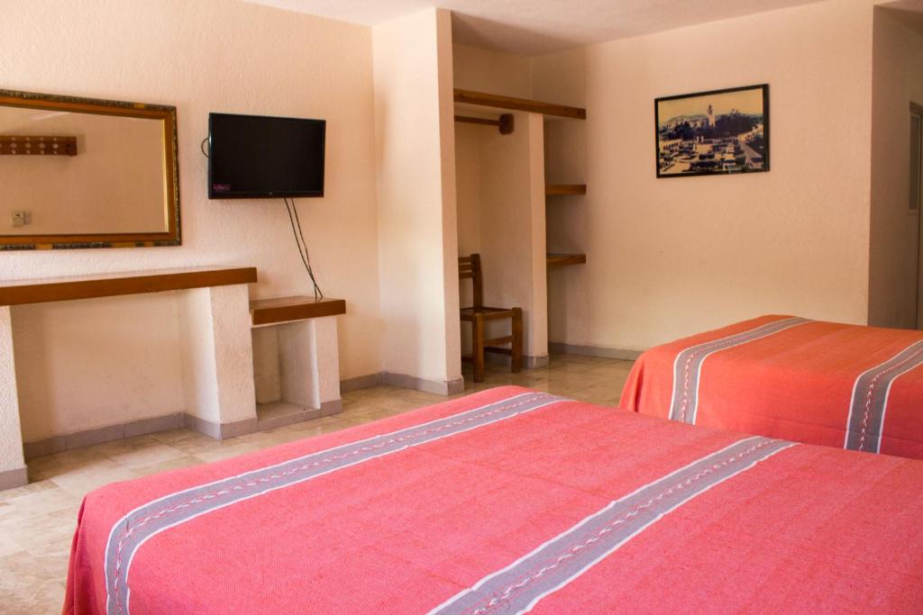 Postel nebo postele na pokoji v ubytování Hotel Avenida Ixmiquilpan