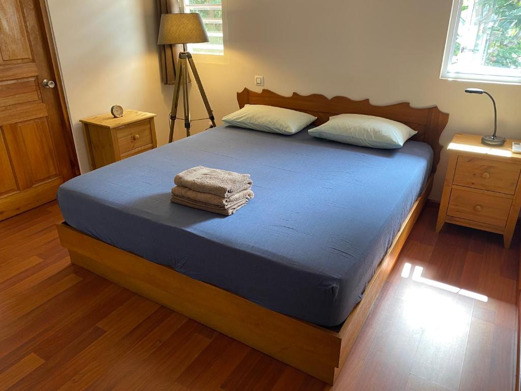 Postel nebo postele na pokoji v ubytování Papeete, appartement F3