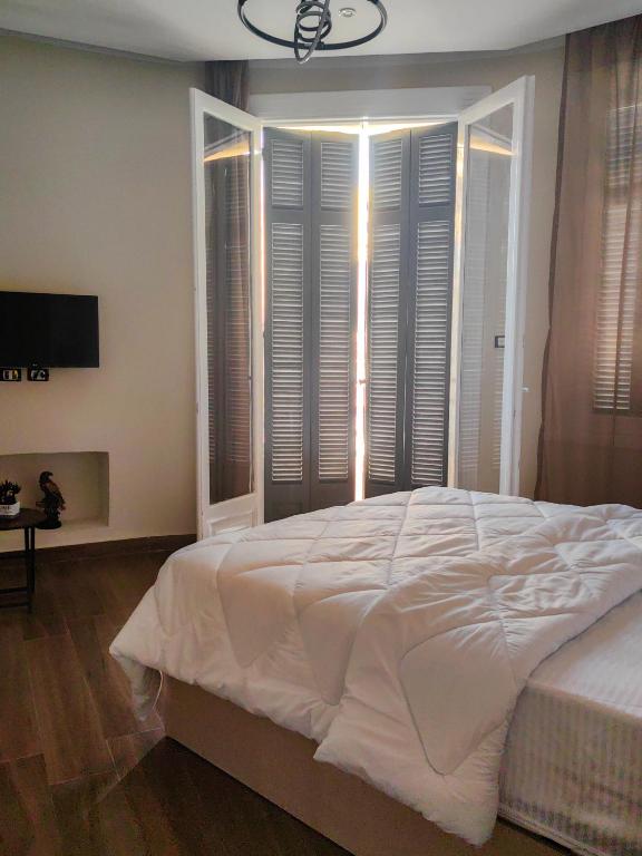 Postel nebo postele na pokoji v ubytování La Casa Del Rey Downtown Cairo