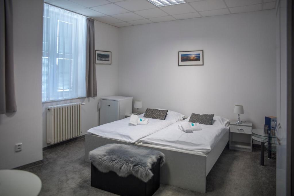 Postel nebo postele na pokoji v ubytování CLASSIC apartmány Třinec