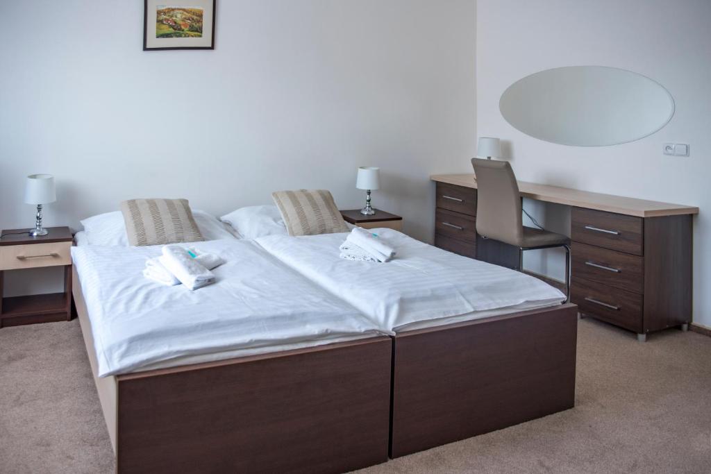 Postel nebo postele na pokoji v ubytování CLASSIC apartmány Třinec