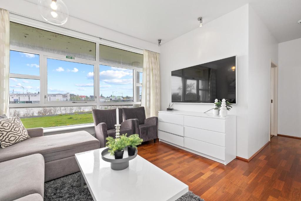 TV a/nebo společenská místnost v ubytování River Apartments