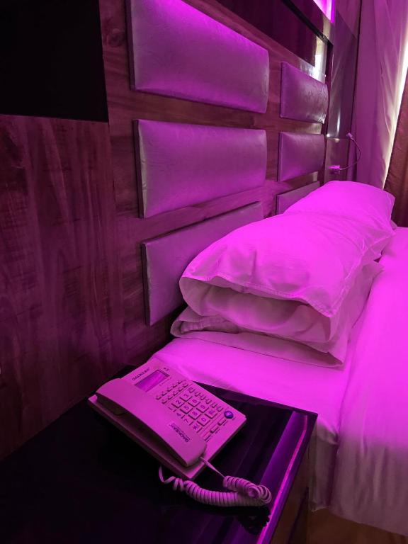 Postel nebo postele na pokoji v ubytování Al- Reef Hotel