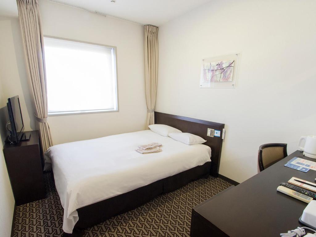 Postel nebo postele na pokoji v ubytování Hearton Hotel Higashi-Shinagawa