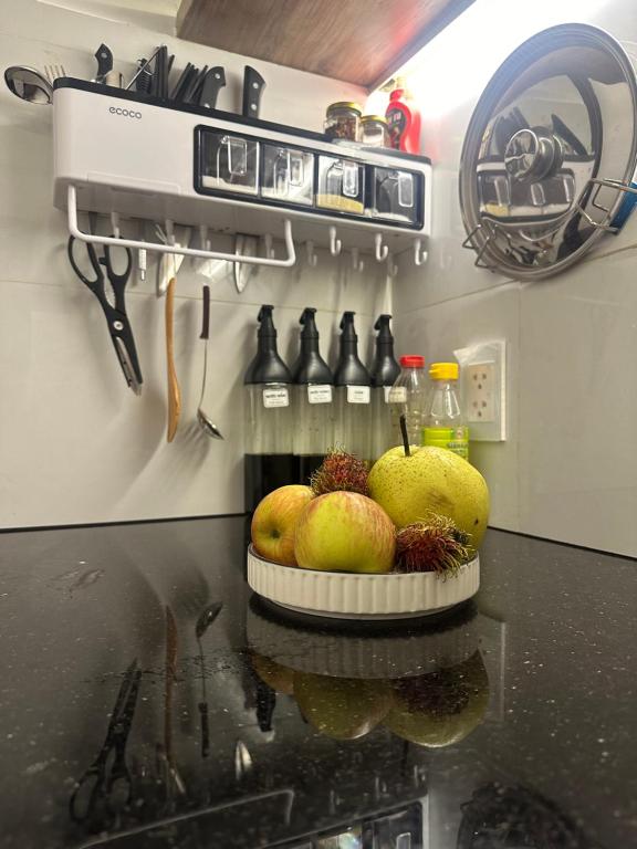 a kitchen with a counter with pears on it at Tom's Homestay in Ho Chi Minh City