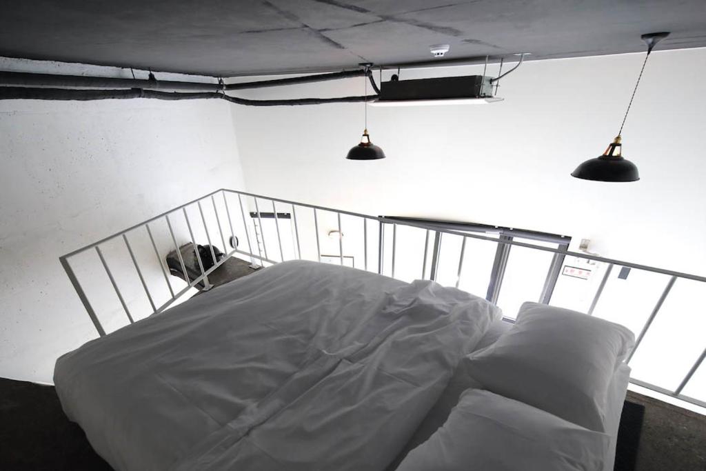 Postel nebo postele na pokoji v ubytování Baguni Hostel