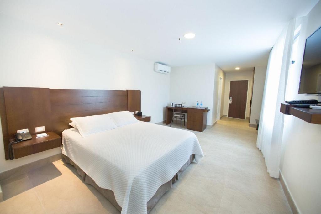 Postel nebo postele na pokoji v ubytování Hotel Marcelius