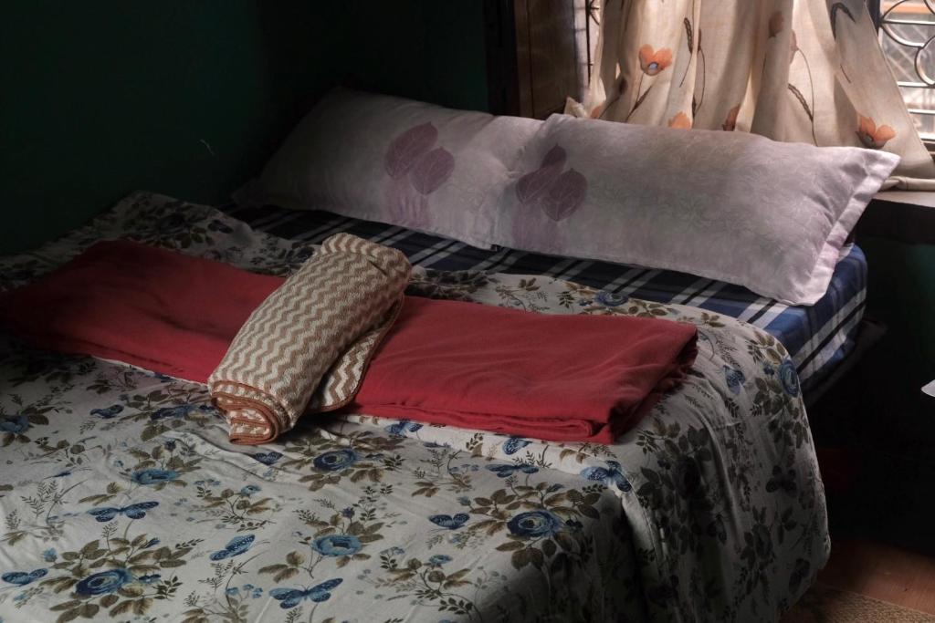 Voodi või voodid majutusasutuse Shekhar's Shared Home toas