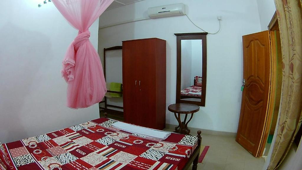 Postel nebo postele na pokoji v ubytování Sea Zone Hotel Nilaveli