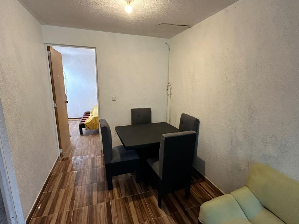 a dining room table and chairs in a room at Casa San Pedro in Los Órganos