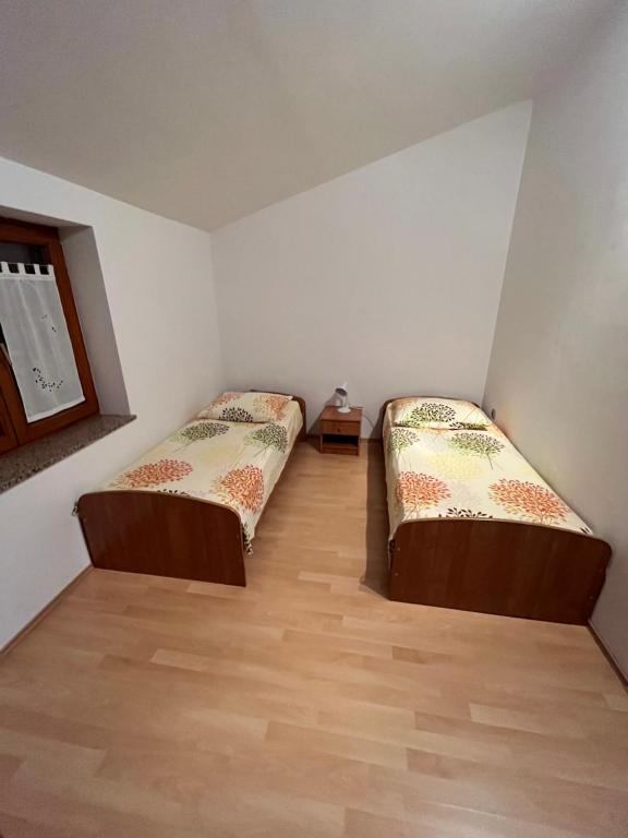 Postel nebo postele na pokoji v ubytování Apartments Klabjan