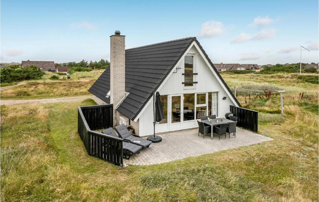 an overhead view of a small house with a patio at Holiday Home Hvide Sande With A Fireplace 05 in Bjerregård
