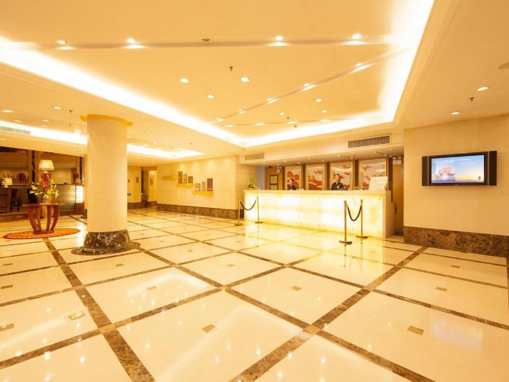 a large lobby with a reception desk in a building at Argyle International Airport Hotel Shanghai in Shanghai