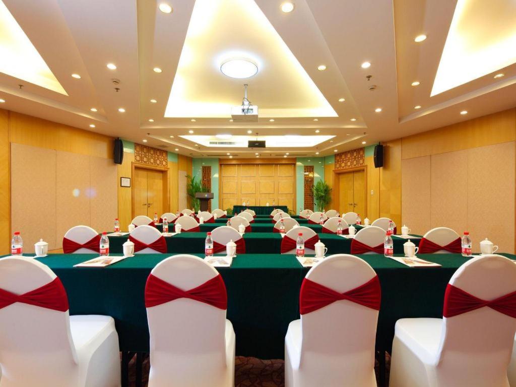 a conference room with a long table and chairs at Argyle International Airport Hotel Shanghai in Shanghai