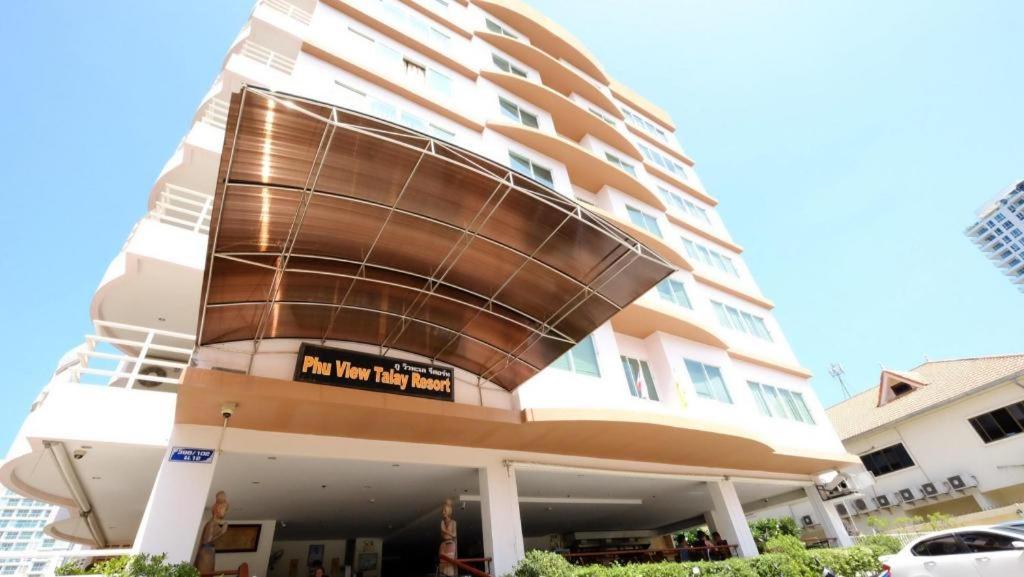 a large apartment building with a round building at Phu View Talay Resort in Pattaya South
