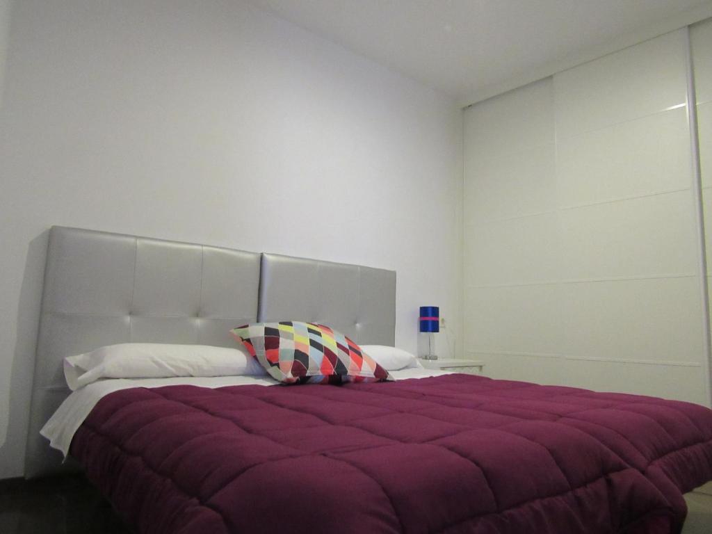 Posteľ alebo postele v izbe v ubytovaní Apartamentos Ilíberis