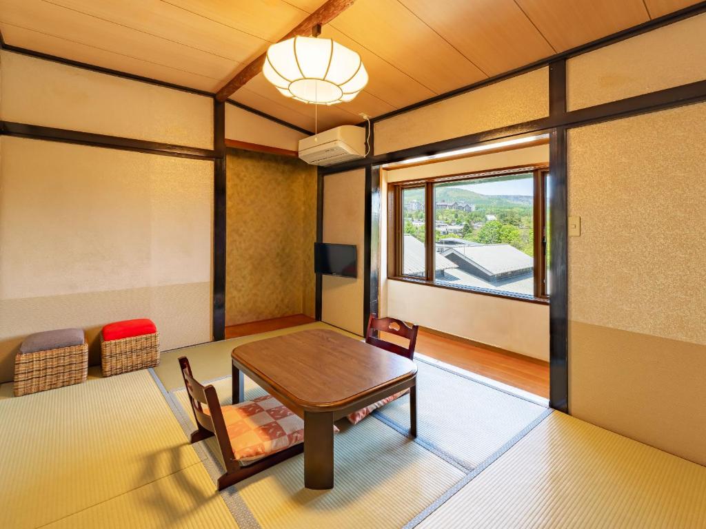 Posezení v ubytování くさつのお宿 清重館 Kiyoshigekan 素泊りの宿