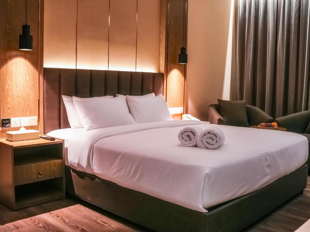 Postel nebo postele na pokoji v ubytování Frankincense Hotel Muscat فندق اللبان مسقط