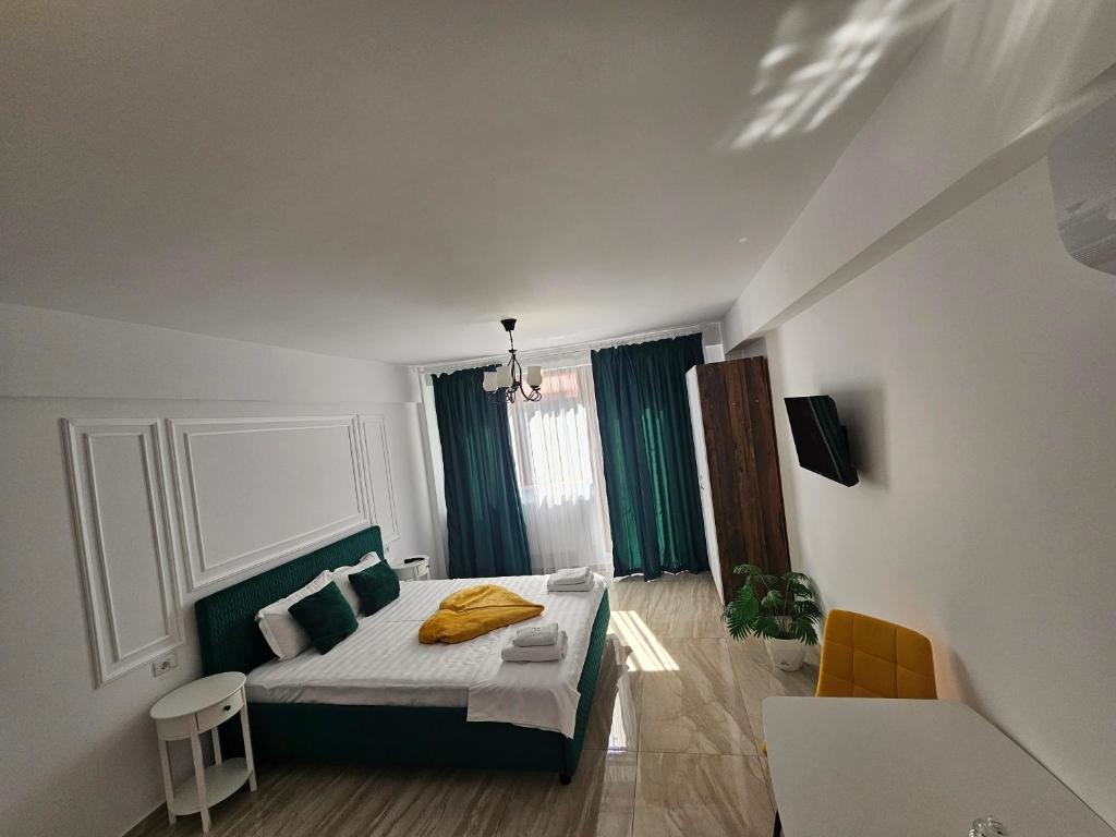 Postel nebo postele na pokoji v ubytování DIDI Apartament