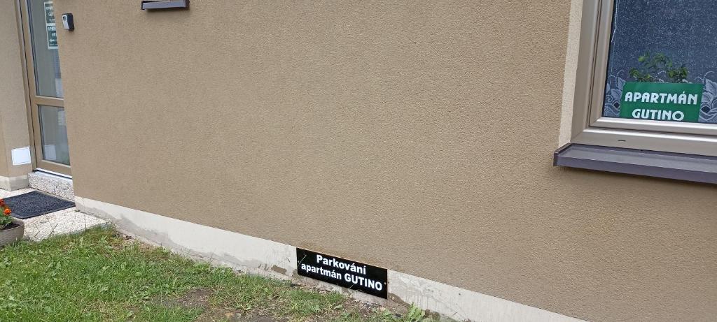 a sign that is on the side of a building at Apartmán GUTINO in Česká Třebová