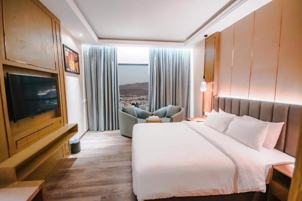 Postel nebo postele na pokoji v ubytování Frankincense Hotel Muscat فندق اللبان مسقط