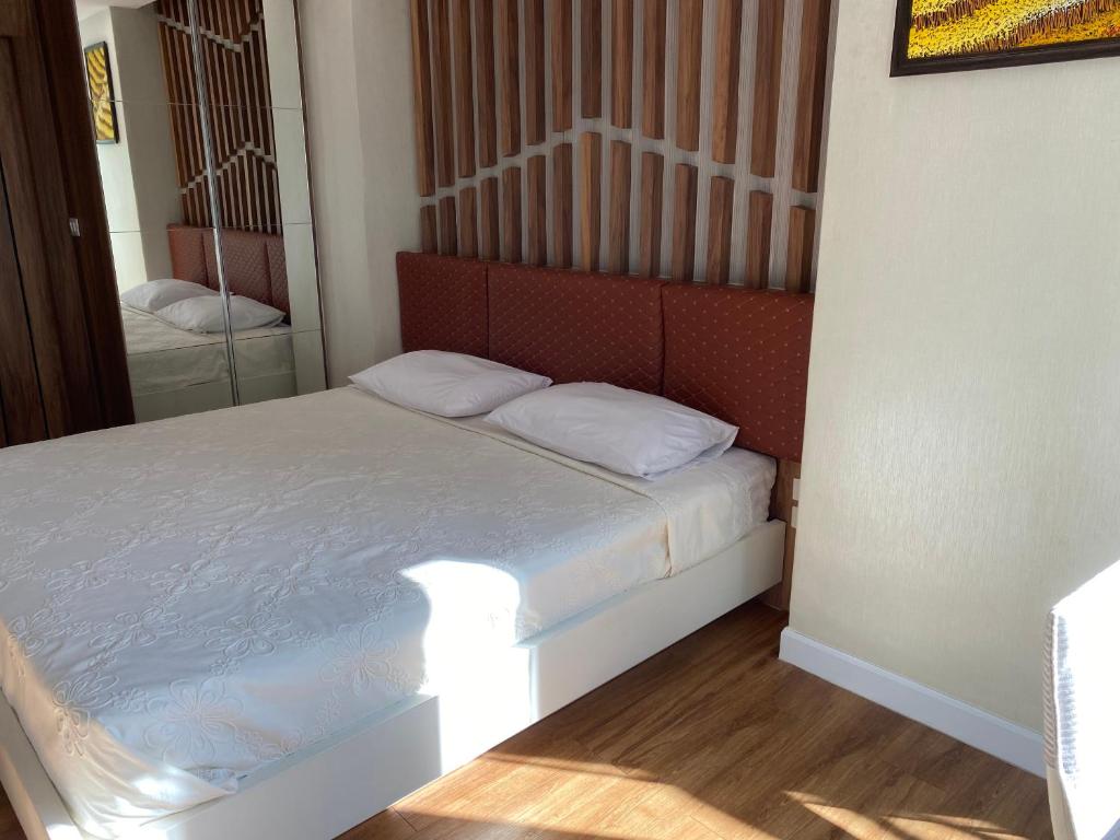 Postel nebo postele na pokoji v ubytování Dusit Grand Park Condo